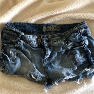 Distressed denim cutoffs
